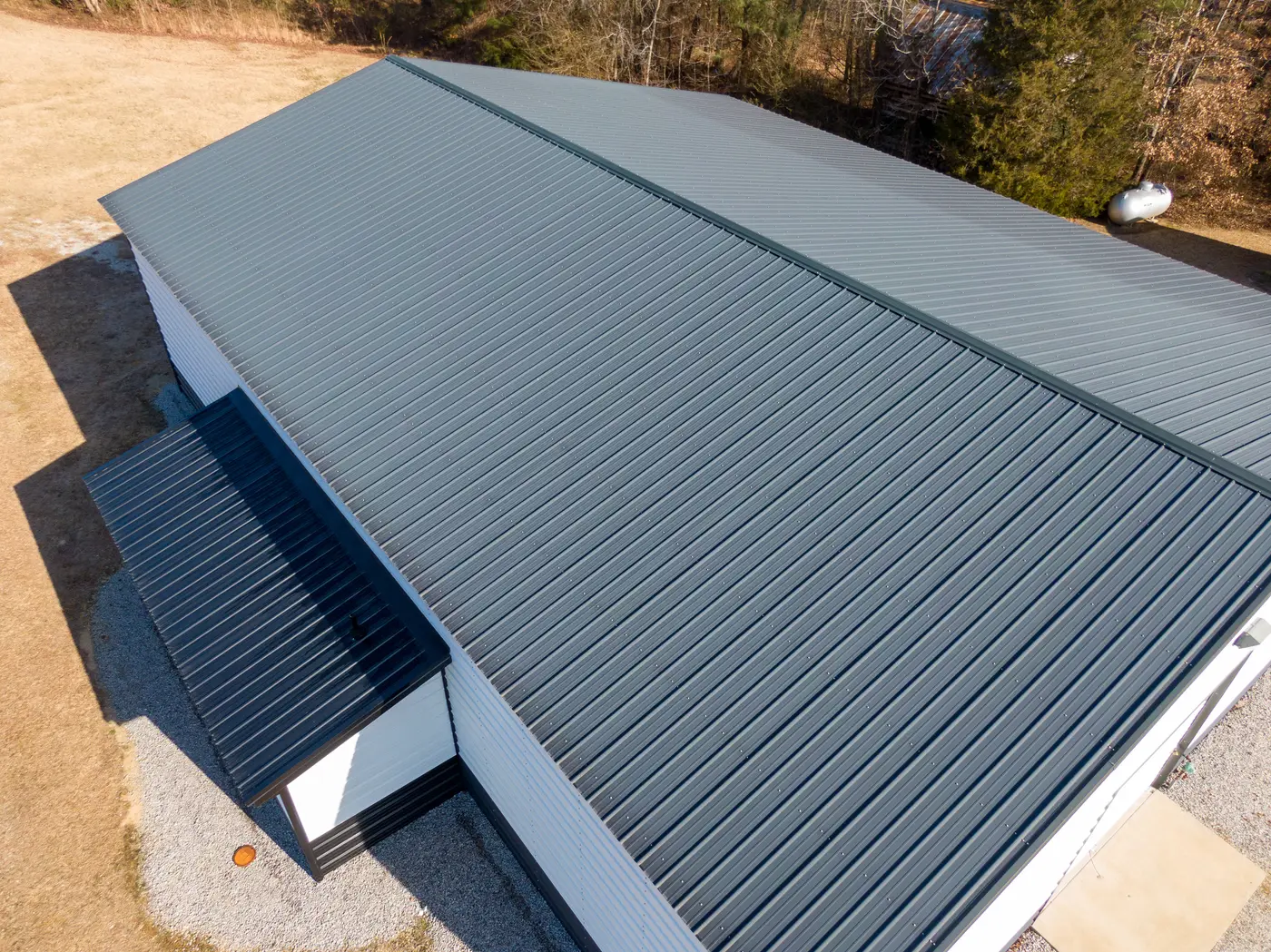 Aerial view of a grey box profile metal roof on a commercial industrial unit in Bath