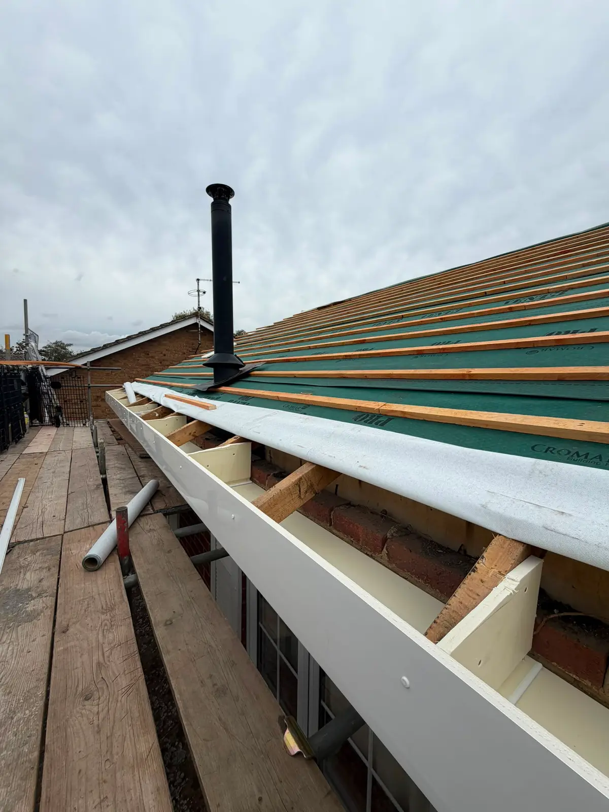New white UPVC fascia fitted at the eaves during roofline work in Newbury