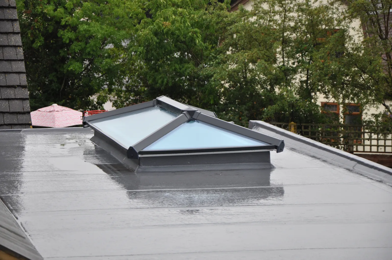 Glazed roof lantern set into a grey single ply flat roof membrane in Devizes